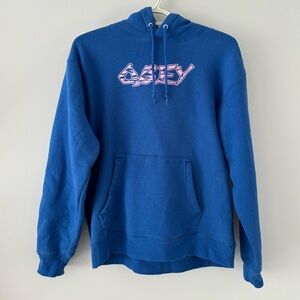 OBEY- Ocean Blue Colour hoodie with graphic designs and purple/pink writing